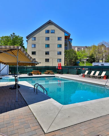 Panoramic view of Mountain Green Resort condo complex in Killington, VT, in winter.